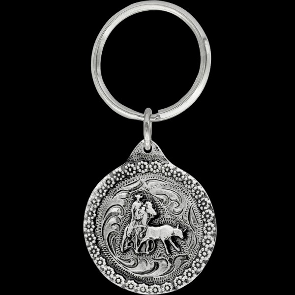 Lasso up some style with our Heeler Keychain. Meticulously designed, it's a nod to the skill and agility of team roping enthusiasts. Order now!